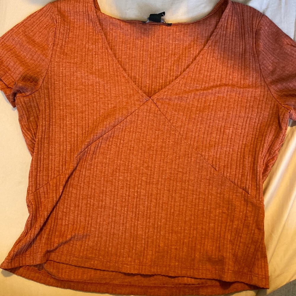 Cute v-neck top. New and only worn a few amount of times!